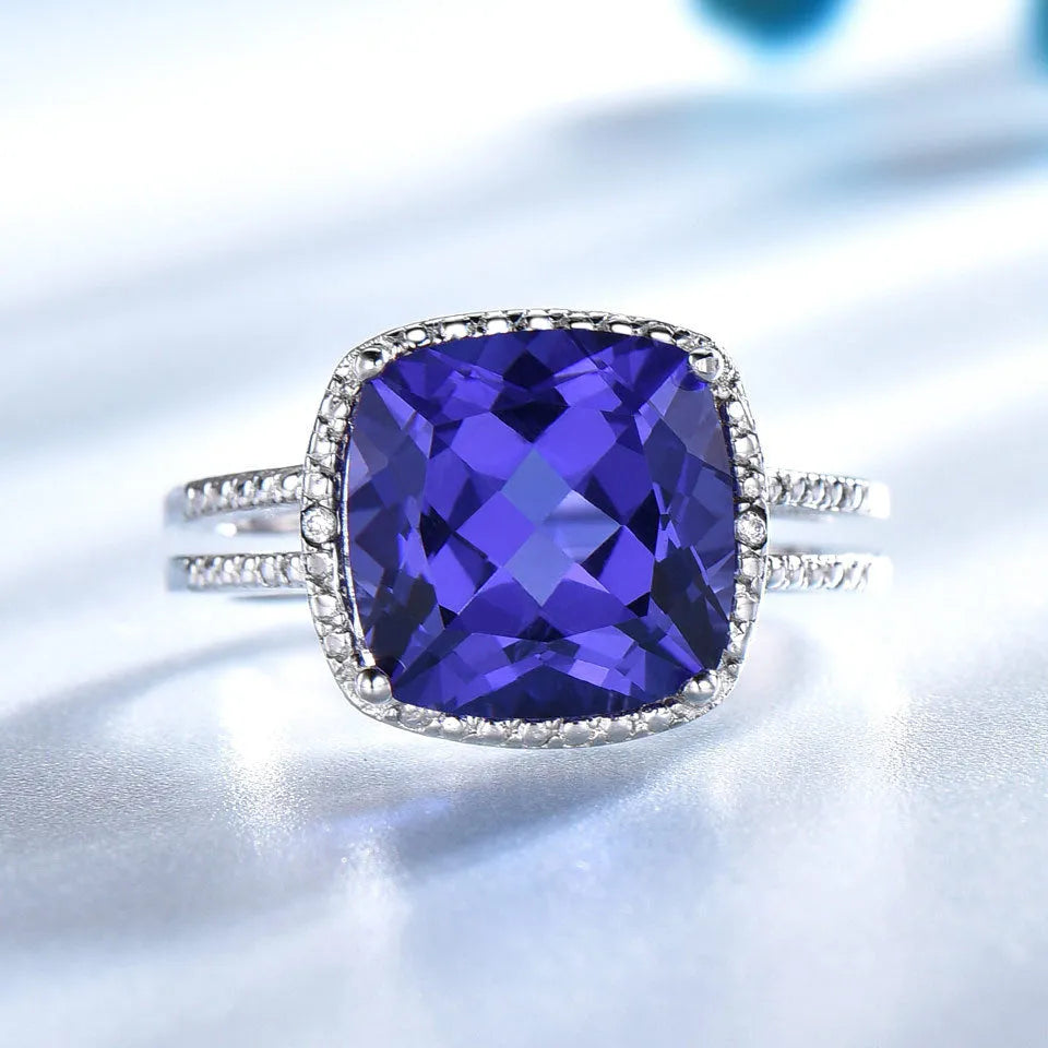 A blue tanzanite stone set in a sterling silver women's ring, showing front detail.