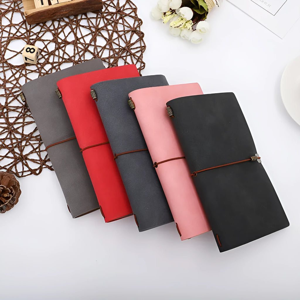 A6 imitation leather notebook with cowhide rope decoration, open to show flat-lying wireless binding.