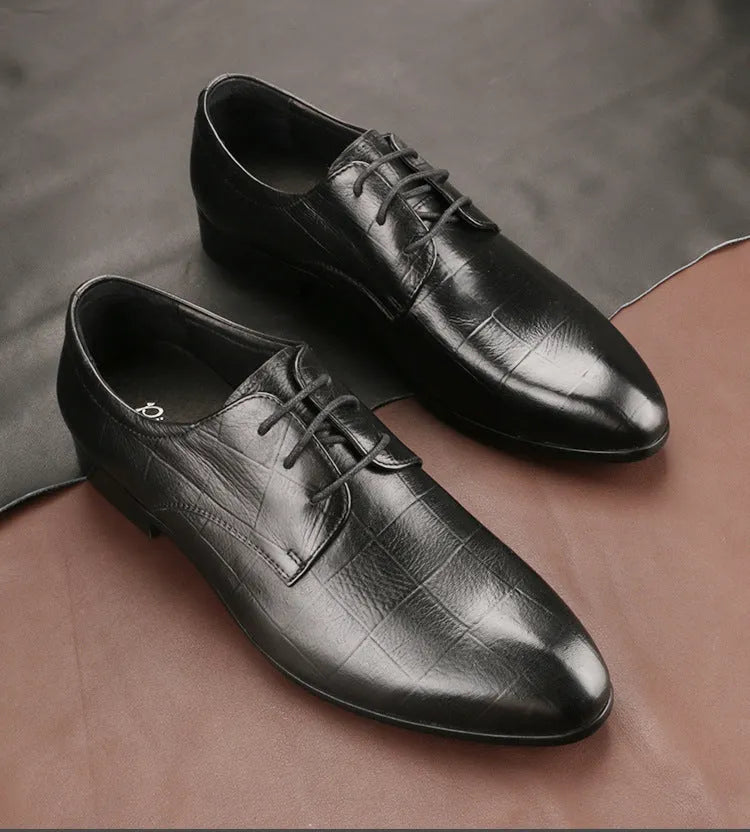Men's black leather derby shoes with a checkered pattern on the pointed toe.