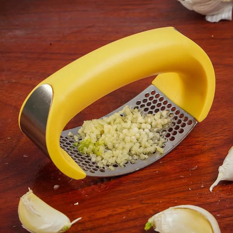 Stainless steel garlic masher press with ergonomic handle and non-slip grip