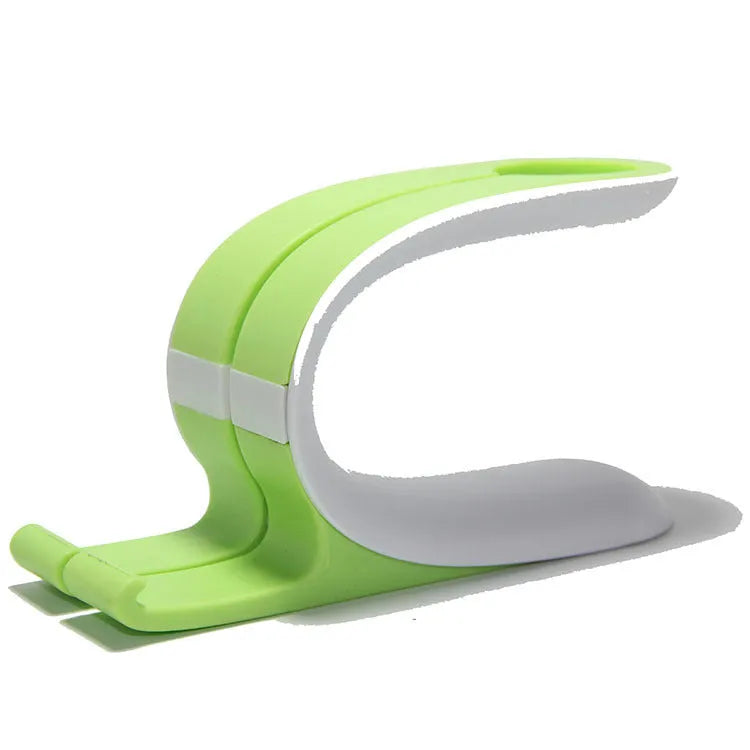 Grey desktop charging stand holding iPhone and Apple Watch