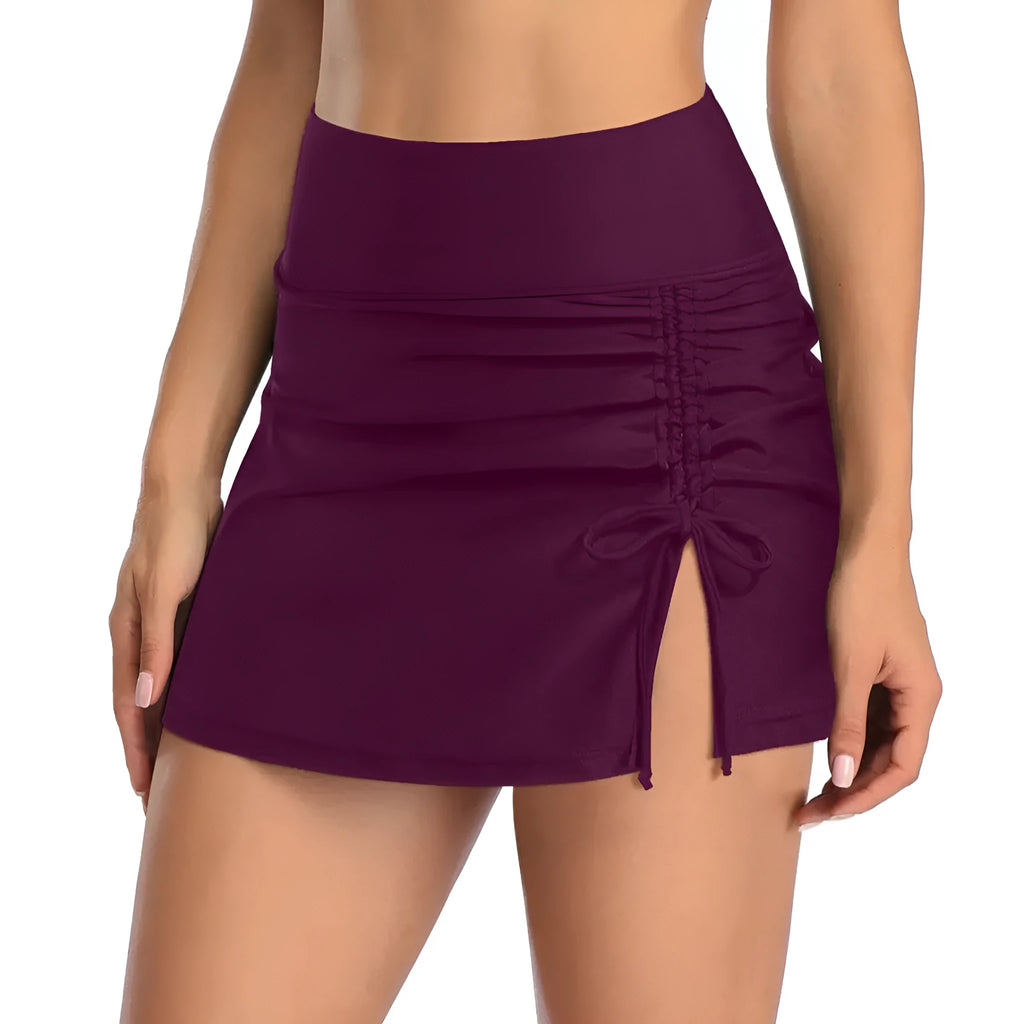 Women's solid colour briefs-style swimming trunks in polyester fabric