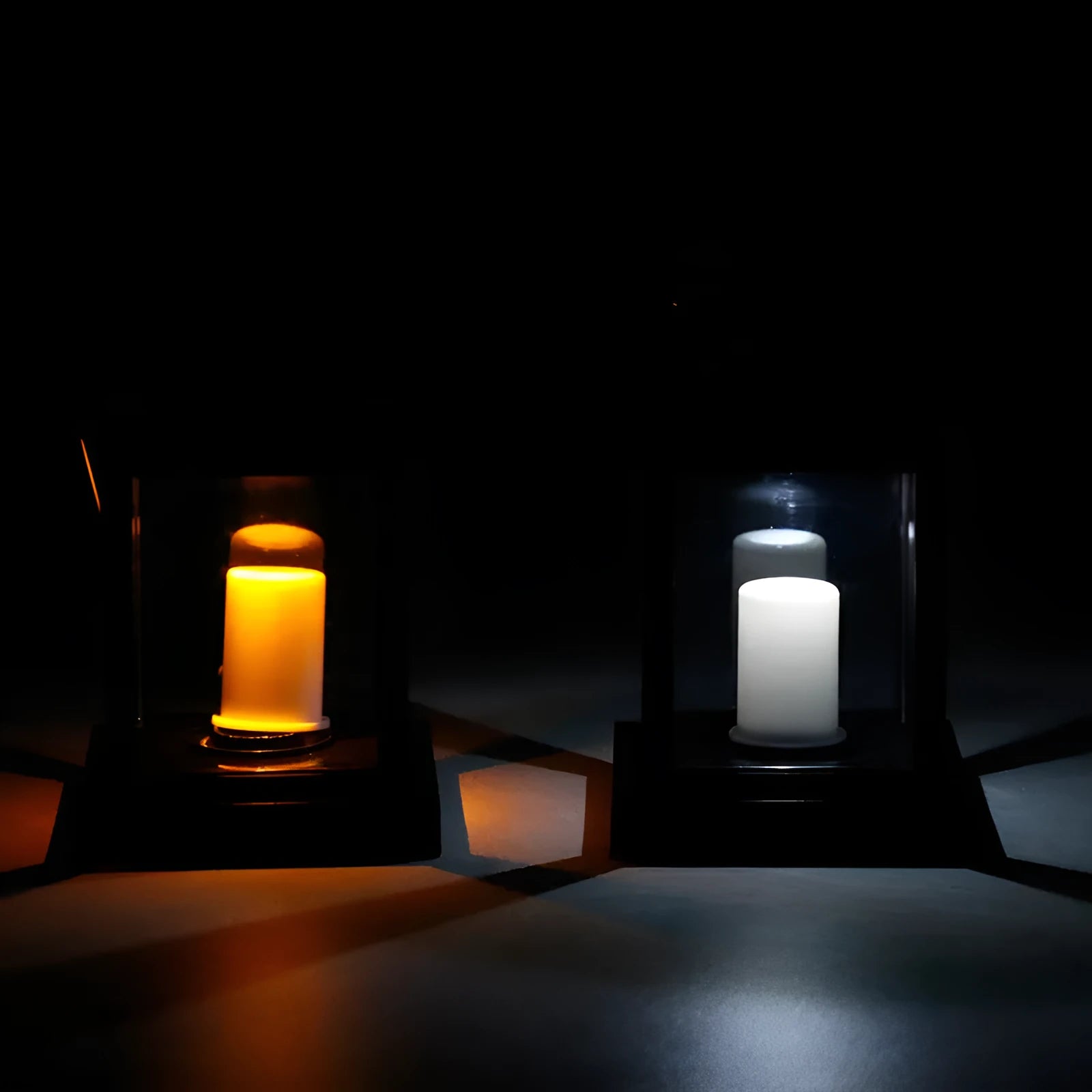 Solar LED candle light with black plastic shade, monocrystalline panel, and warm white illumination on garden path