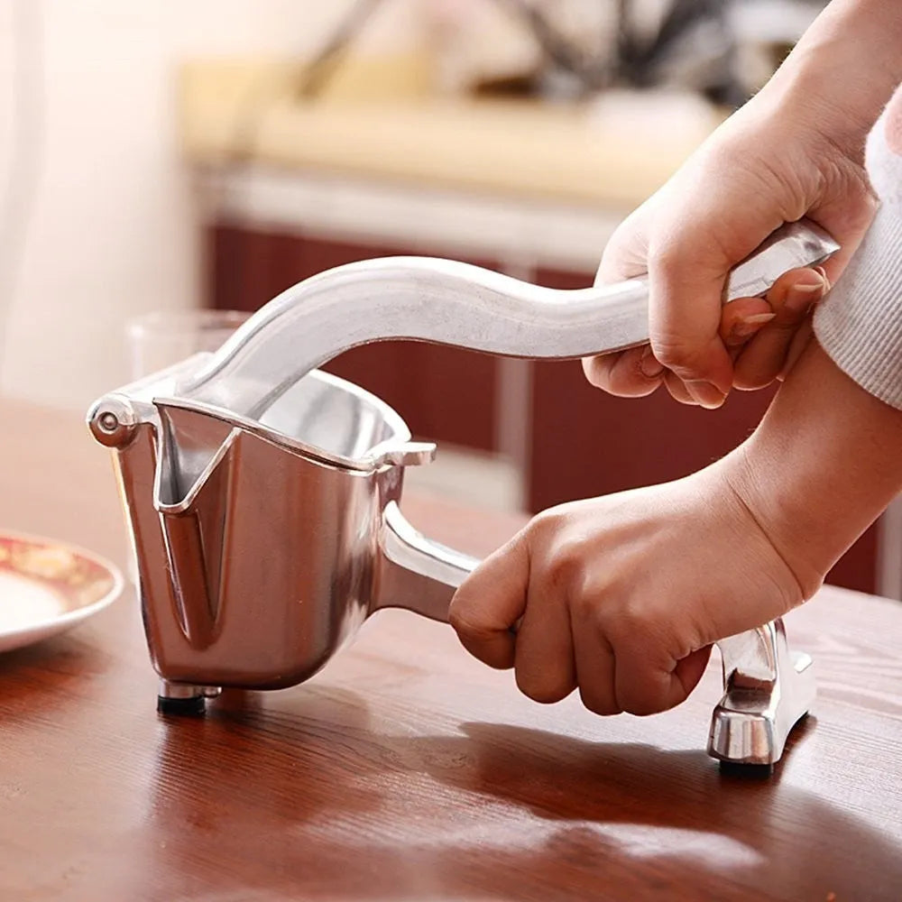 Silver heavy duty aluminium alloy lemon squeezer with extra large bowl on a kitchen counter