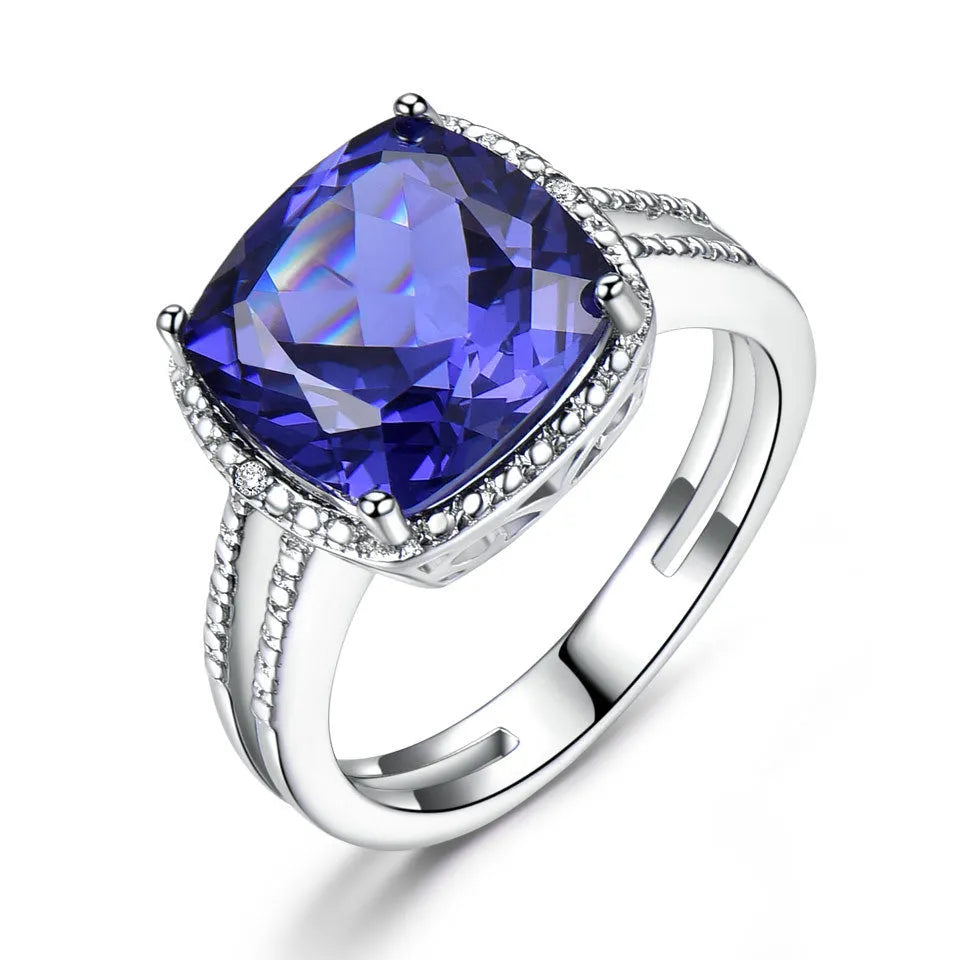 A blue tanzanite stone set in a sterling silver women's ring, showing front detail.