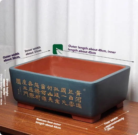 Purple clay Chinese style flower pot with plant on desktop, available in multiple colours and sizes