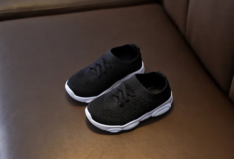 Children's fabric slip-on shoes with non-slip rubber soles in white, black, pink or grey colours