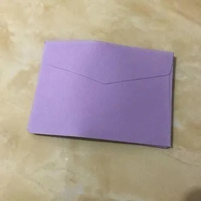 Mini coloured envelopes in assorted colours showing 11.5cm by 8cm dimensions and western-style flap