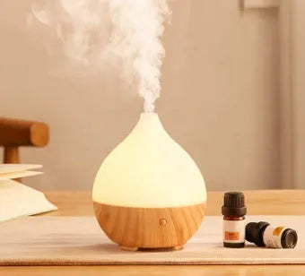 Asakusa wood grain finish vase-shaped aroma diffuser with USB cable on a wooden surface.