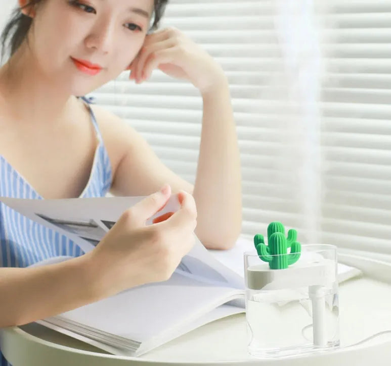 Transparent green cactus-shaped portable USB humidifier on a desk, 120mm tall