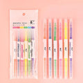 Six double-headed highlighter pens showing round and oblique nibs in orange, purple, yellow, green, blue, and pink colours