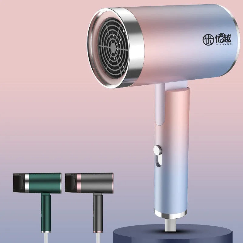 Foldable negative ion hair dryer in emerald green colour with foldable handle and single nozzle
