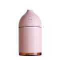 White USB aroma diffuser and humidifier with 300ml tank and LED light on a wooden surface.