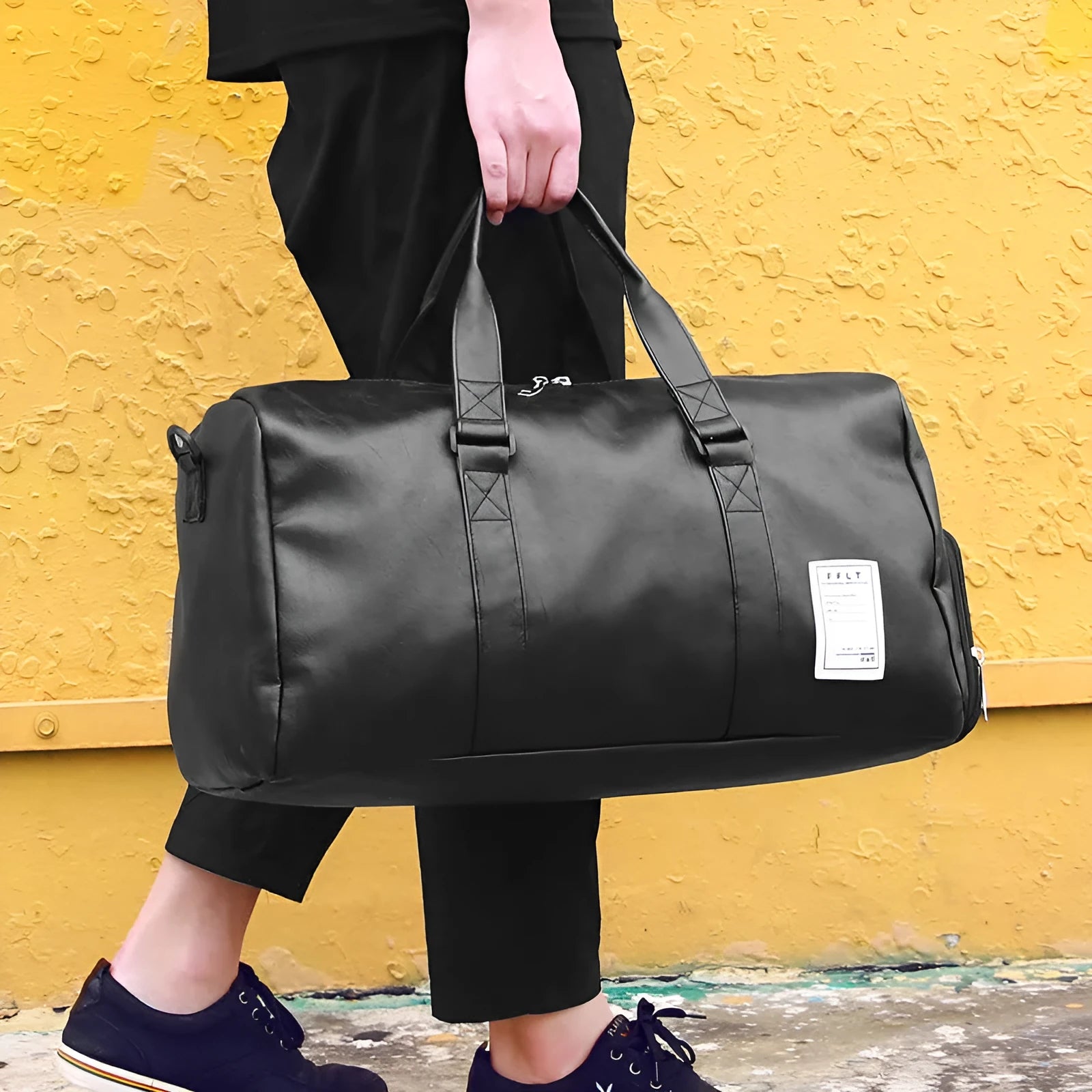 Black waterproof sports fitness bag with separate shoe compartments and diagonal carrying straps