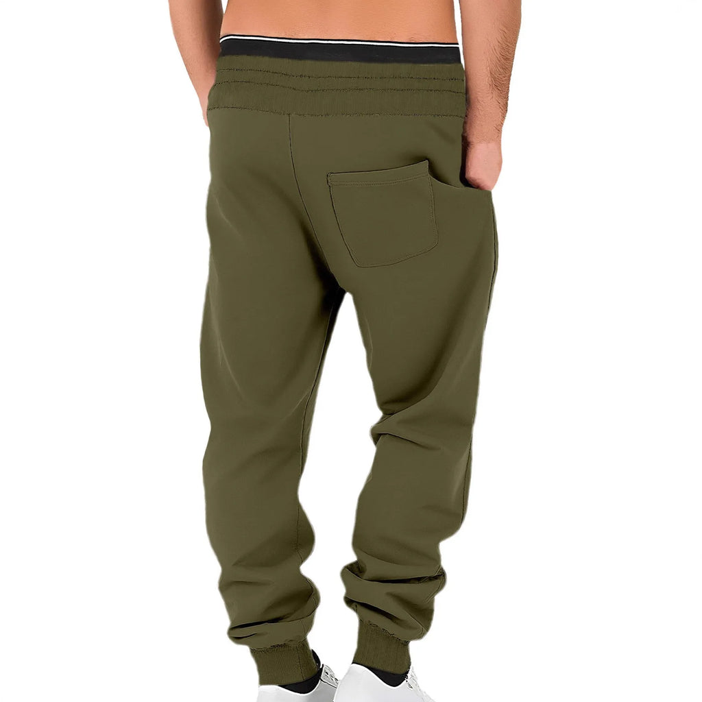 Men's loose cuffed fleece-lined sweatpants in army green, shown flat lay, with drawstring waist and elastic cuffs