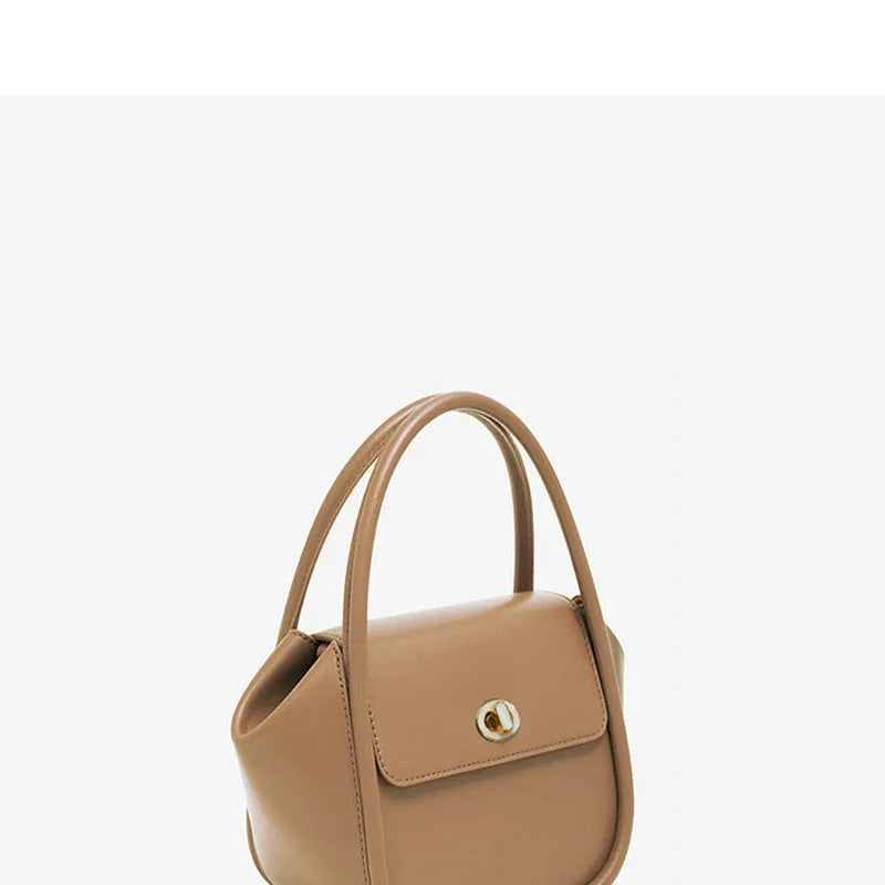 Wing shape cow leather cross-body handbag with buckle detail and fabric lining