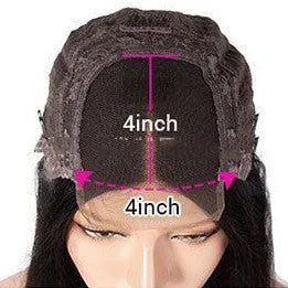 A woman wearing a real human hair lace front wig with a 4x4 lace closure, showcasing long, styled hair.