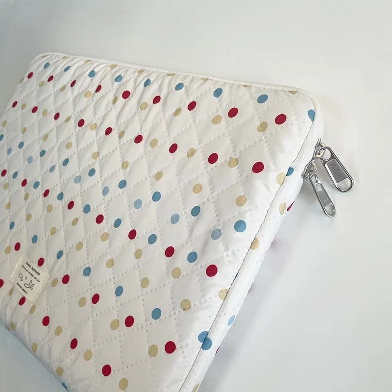 Women's polka dot polyester laptop bag showing front view with storage compartments