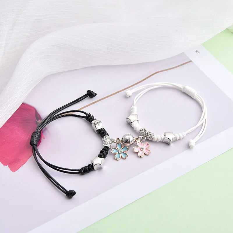 Magnet couple bracelets with electroplated finish showing magnetic clasp and symbolic design options