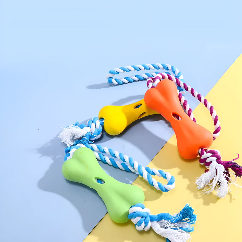 Green porous bone-shaped dog toy with rope knot texture and slots for beef strips or cheese treats