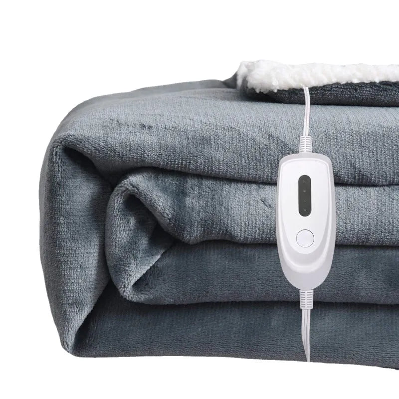 Grey and white USB electric heating blanket with intelligent temperature control on a desk.