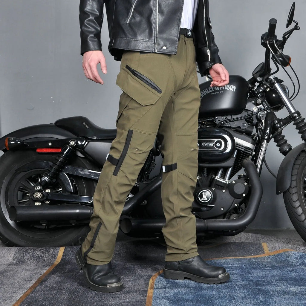 Men's green waterproof motorcycle cycling trousers with belt and protective gear on hanger.