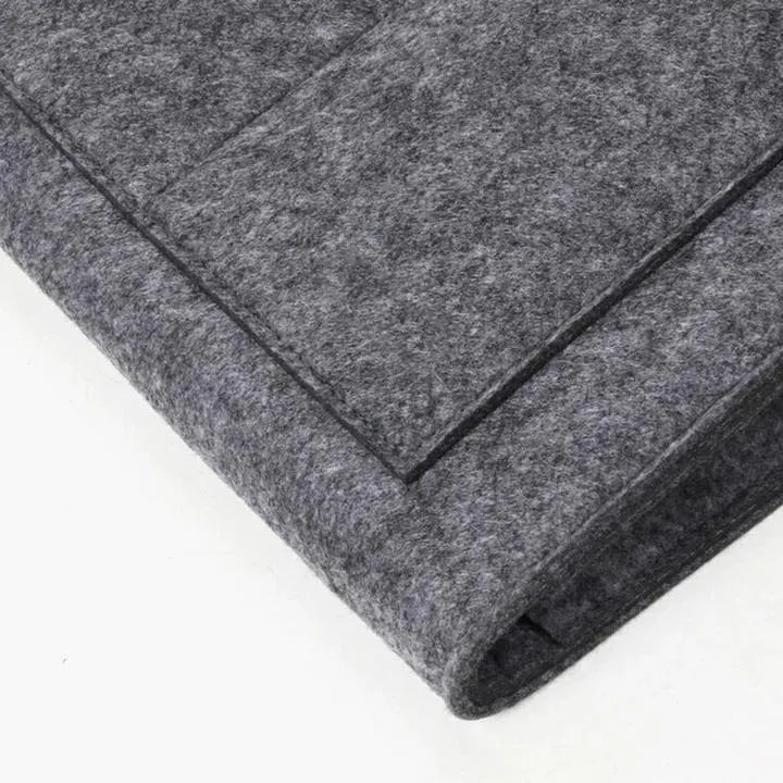 Felt bed storage bag with pocket in beige on a bed, small size 28x24cm, anti-slip organiser for mattress or sofa