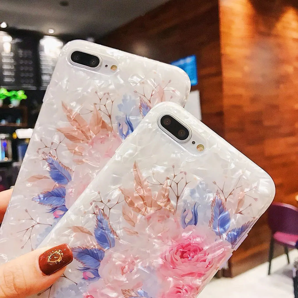 Dream Shell soft TPU iPhone case with rose flower pattern on back, shown in brown colour.