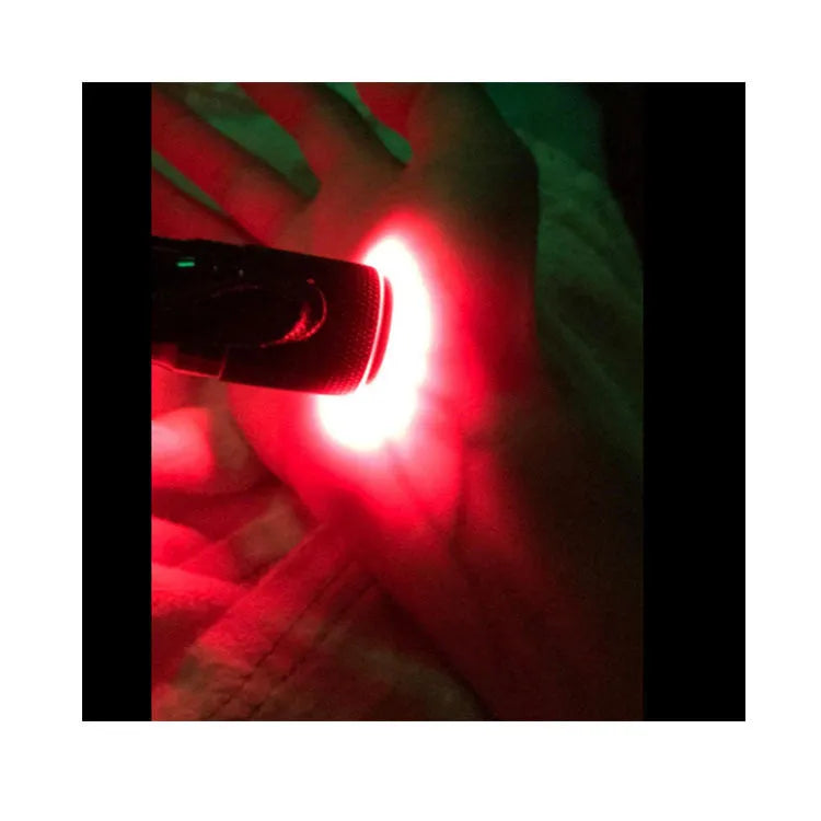 Black aluminium Smart Vein Locator device with red LED lights on, showing compact size.