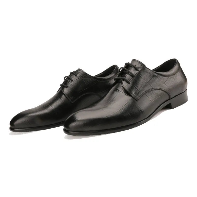 Men's black leather derby shoes with a checkered pattern on the pointed toe.