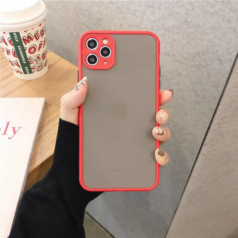 Transparent solid-colour shockproof iPhone case showing soft TPU sides and hard PC back, compatible with multiple models.