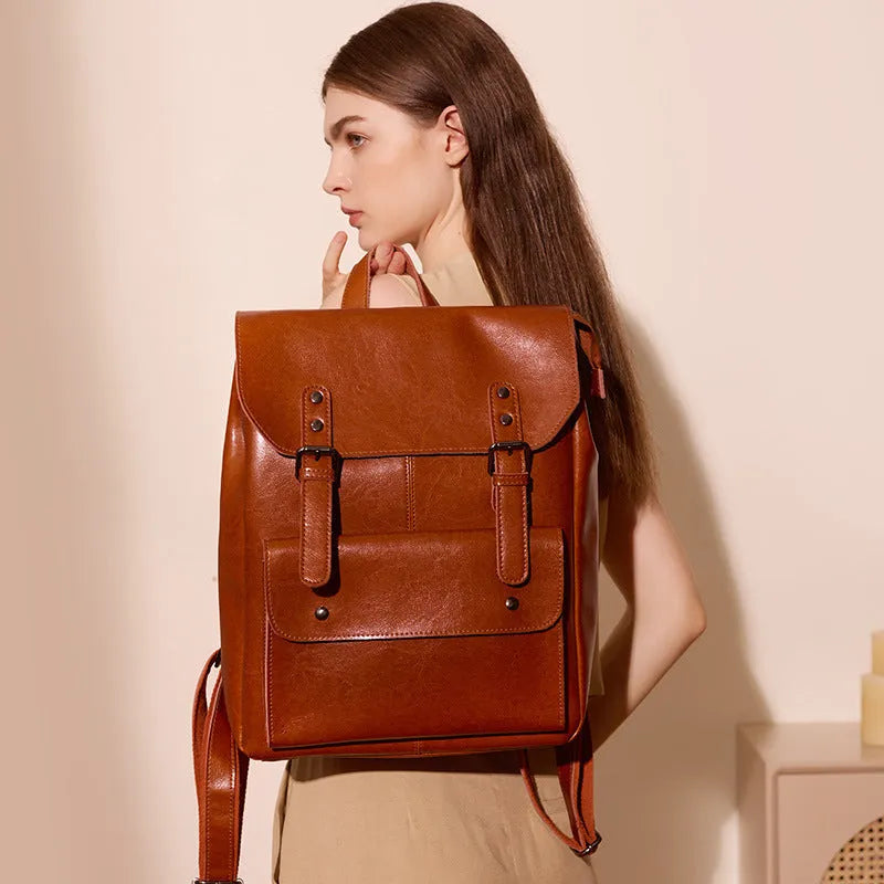 Genuine two-layer cowhide leather computer backpack for women in black, brown, or coffee.