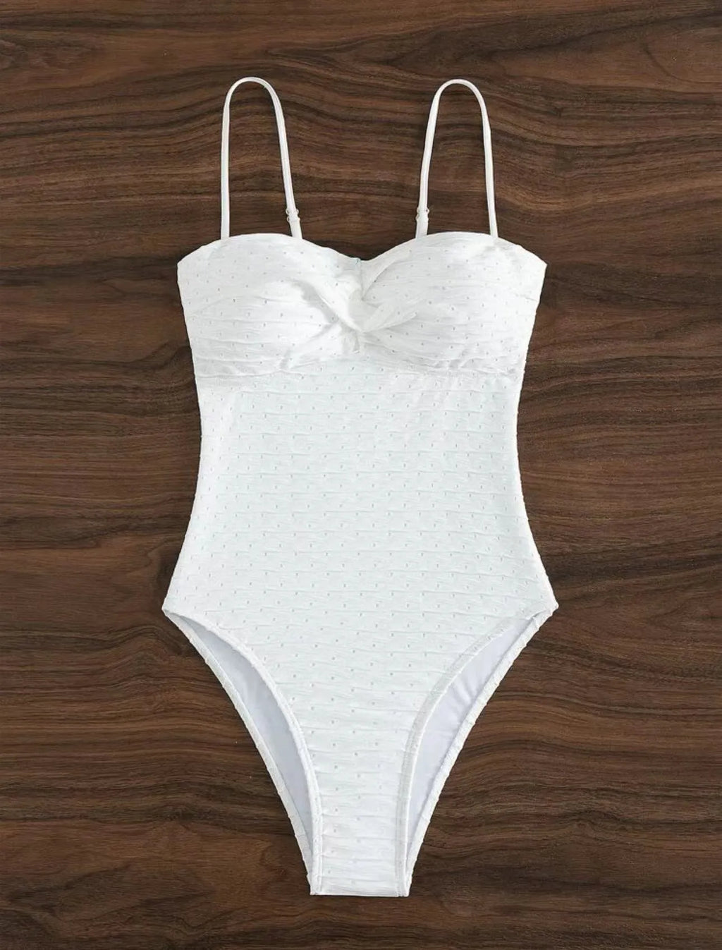 White women's one-piece swimsuit with a sling back and briefs-style cut.