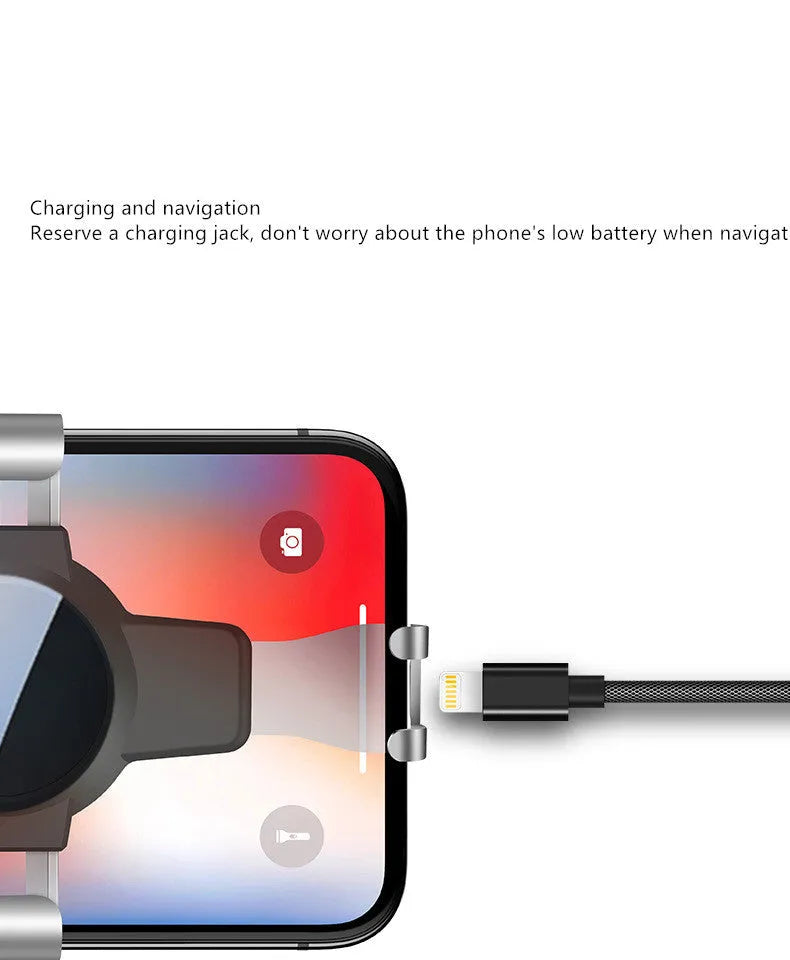 Black S4 gravity mirror ABS phone bracket mounted on a car air conditioning vent, holding a mobile phone.