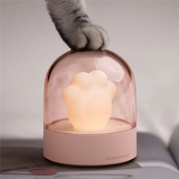 Grey cat paw shaped USB rechargeable night light with music box function on wooden desk