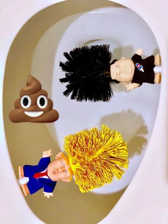 Yellow plastic Donald Trump toilet brush with hanging slot on handle.