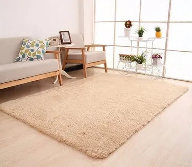 Solid colour plush carpet with soft surface and rectangular shape on hardwood floor
