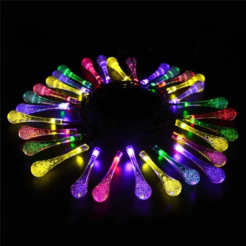 Solar-powered LED outdoor string lights with water drop-shaped pendants on a 6.5m cable