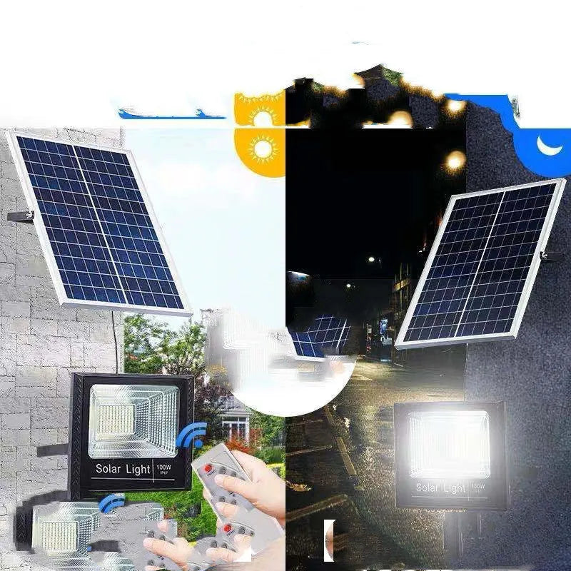 Black solar-powered outdoor LED flood light with remote control on a garden wall.
