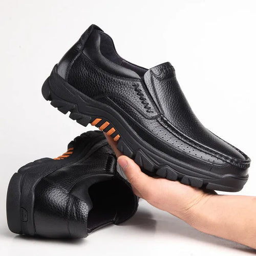 Men's black and brown business casual slip-on shoes made from cowhide leather with rubber soles.