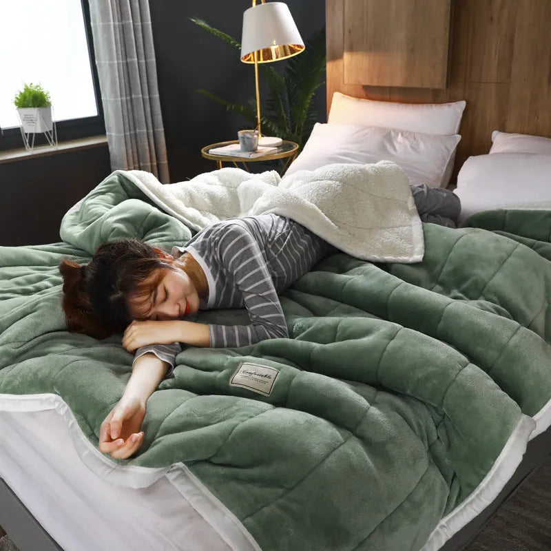Avocado green coral fleece blanket folded to show its thick texture and 150x200cm size.