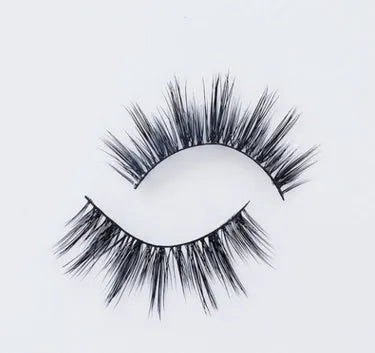 Pair of faux mink eyelashes with long tail and cotton stem against white background