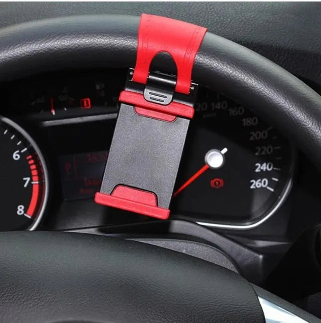 Black universal steering wheel phone clip holder mounted with a smartphone displaying a map.