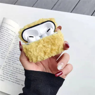 Green plush plastic headphone cover for Apple AirPods showing creative design elements