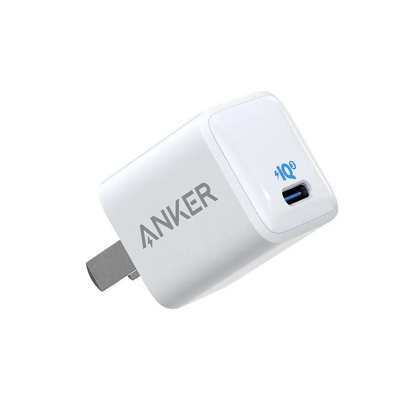 White 18W fast travel USB charger with a UK plug.