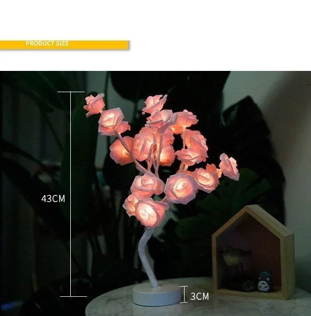 White and red rose flower LED table lamp with bonsai tree lights on a table.