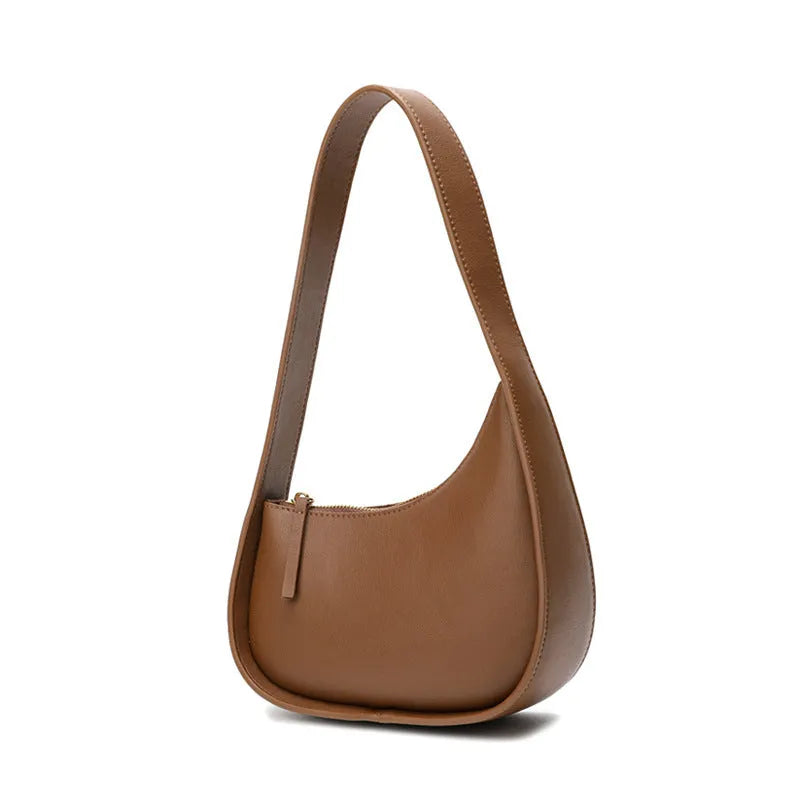 Genuine leather ladies shoulder bag with half moon design and wide strap