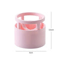 Pink plastic beauty egg stand in girly heart style for dustproof cosmetics storage on a bedroom surface