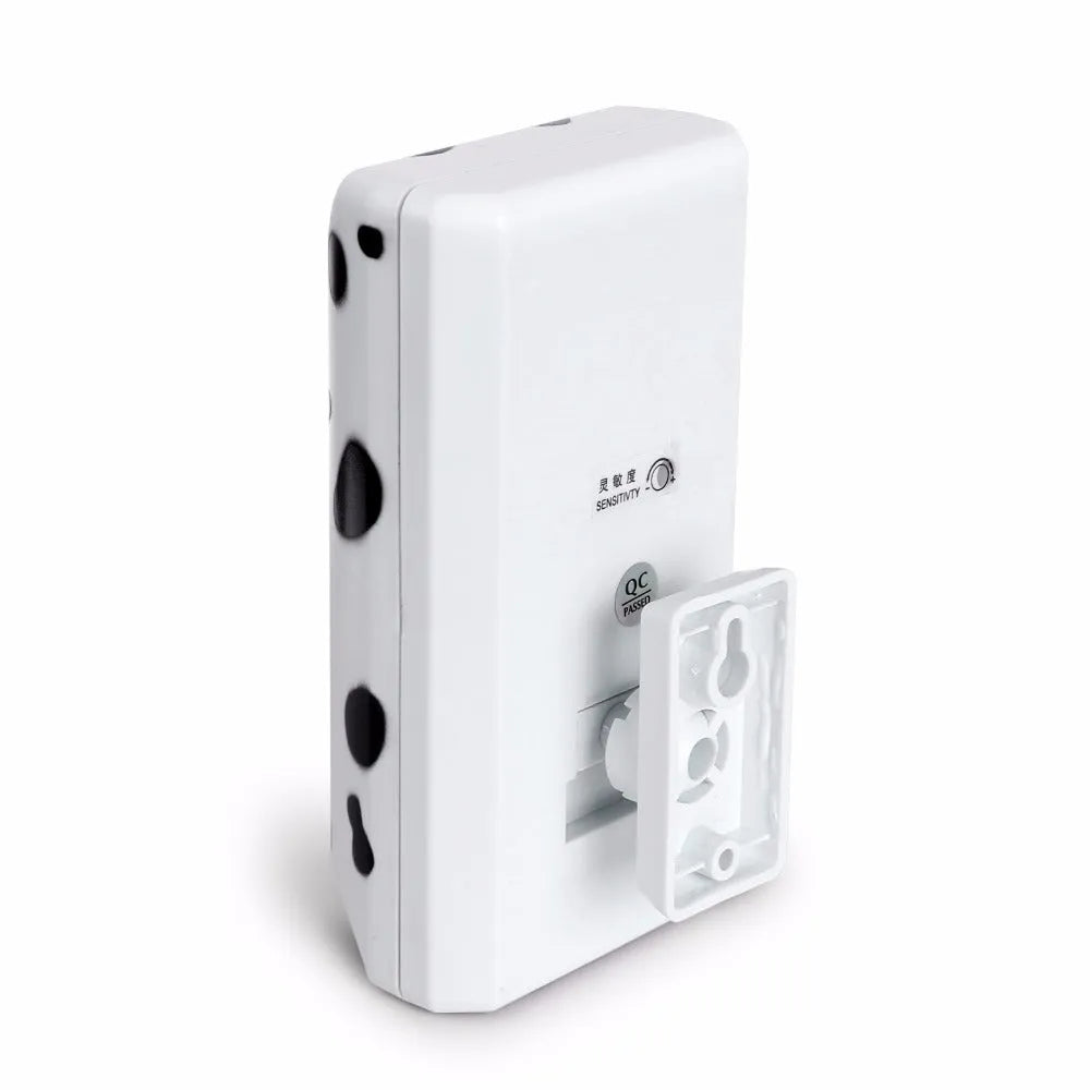 White anti-barking ultrasonic dog repeller mounted on a wall with rotary holder, 7x13x5cm