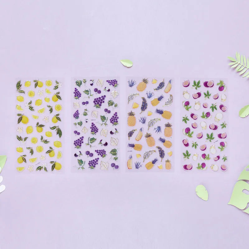 Sheet of six DIY fruit bronzing stickers showing grape, orange, passion fruit, peach, pineapple and strawberry designs.
